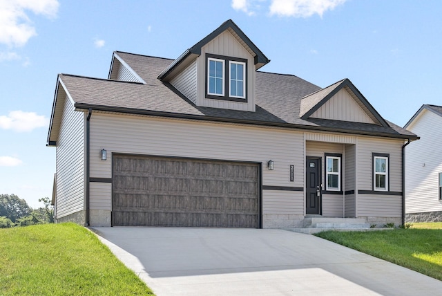 view of front facade with a garage and a front lawn