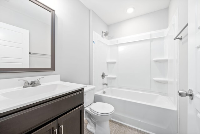 full bathroom featuring vanity,  shower combination, and toilet