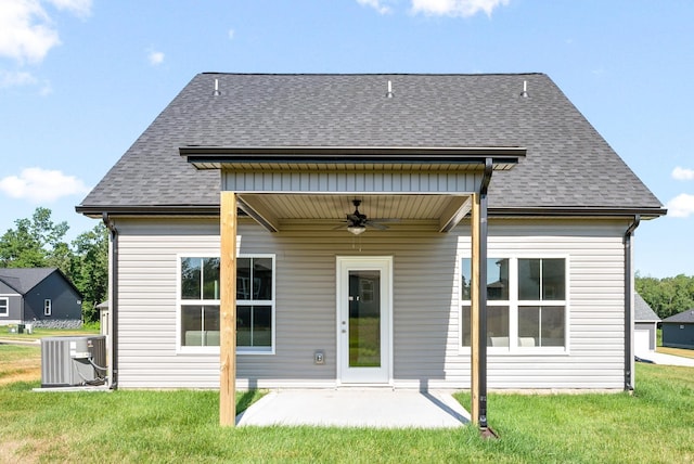 rear view of property with a lawn, ceiling fan, central air condition unit, and a patio