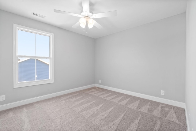 empty room with carpet flooring and ceiling fan