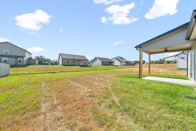 view of yard with ceiling fan