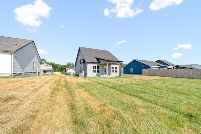 back of house featuring a yard