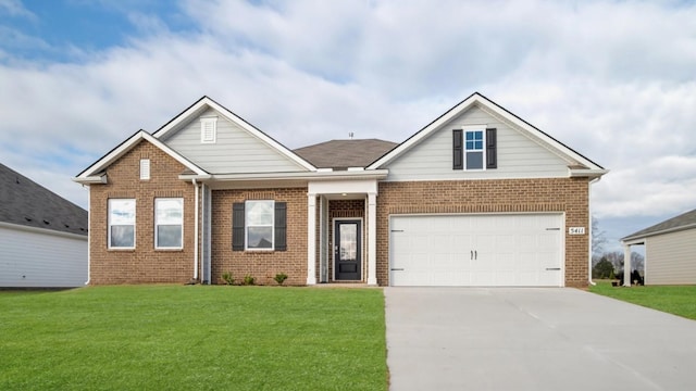 view of front of house featuring a front lawn and a garage