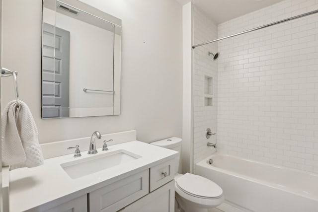 full bathroom featuring vanity, toilet, and tiled shower / bath