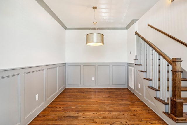 unfurnished dining area featuring dark hardwood / wood-style floors