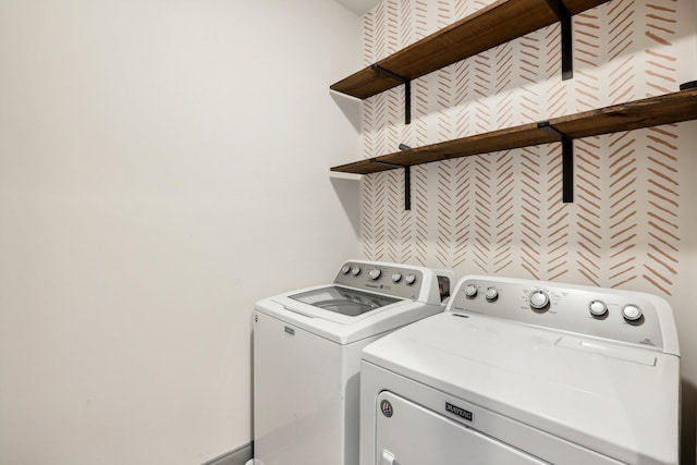 clothes washing area with independent washer and dryer