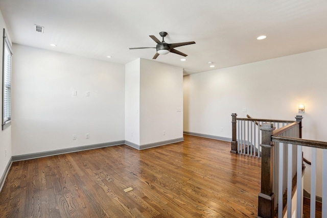 unfurnished room featuring ceiling fan and wood-type flooring