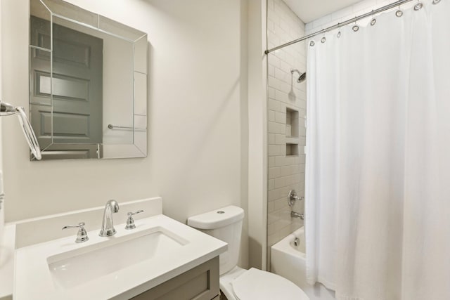 full bathroom featuring vanity, toilet, and shower / tub combo with curtain