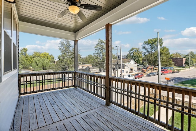 wooden deck featuring ceiling fan