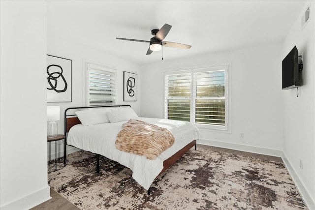 bedroom with ceiling fan and hardwood / wood-style floors