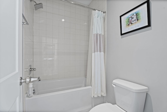 bathroom featuring shower / bath combo with shower curtain and toilet