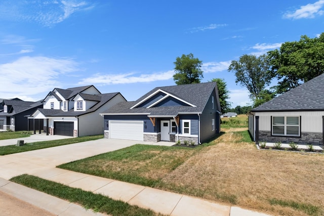 craftsman-style house with a front yard and a garage