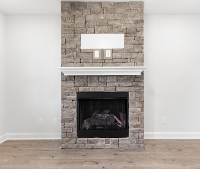 details with a fireplace and hardwood / wood-style floors