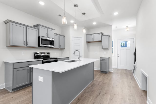 kitchen with gray cabinets, sink, and stainless steel appliances