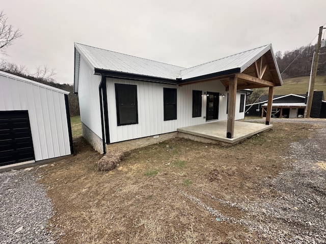 back of house with a patio area