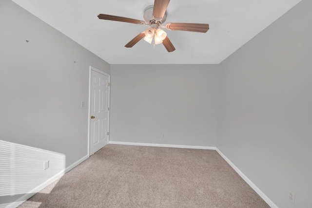 empty room featuring ceiling fan and carpet floors