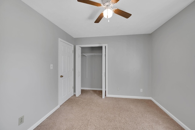 unfurnished bedroom featuring ceiling fan and light carpet