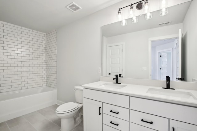 full bathroom featuring tile patterned flooring, vanity, toilet, and tiled shower / bath combo