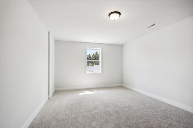 spare room featuring carpet flooring