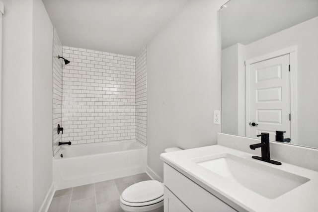 full bathroom featuring tile patterned flooring, vanity, tiled shower / bath combo, and toilet