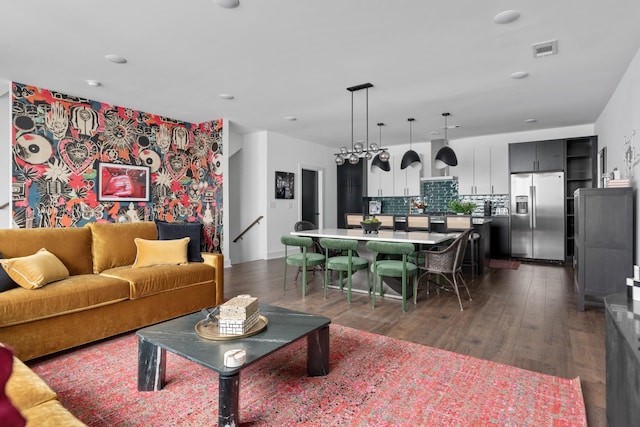 living room featuring dark wood-type flooring