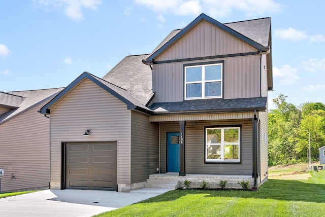 view of front of property featuring a garage and a front yard