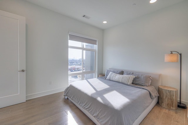 bedroom with wood-type flooring