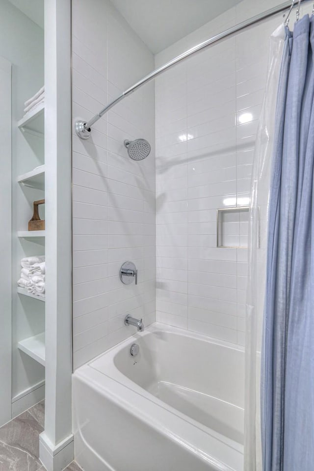 bathroom with built in features and shower / bath combination with curtain