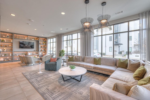 tiled living room featuring built in shelves