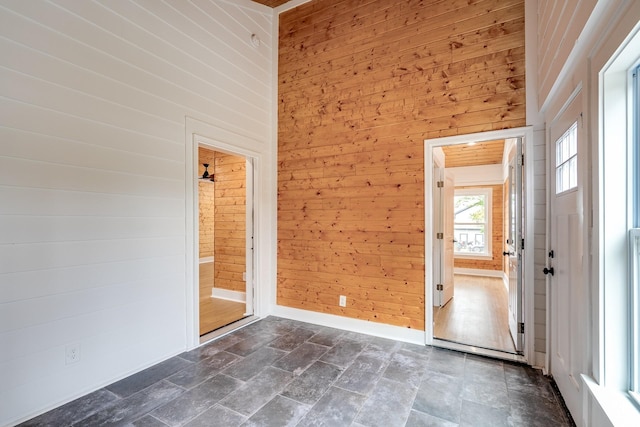 interior space featuring wooden walls