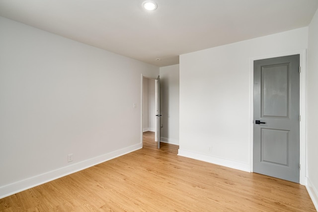 empty room with light hardwood / wood-style floors