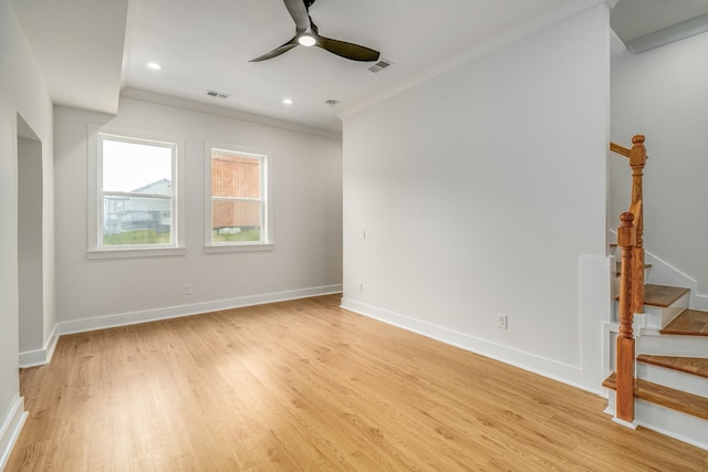 unfurnished room with crown molding, ceiling fan, and light wood-type flooring