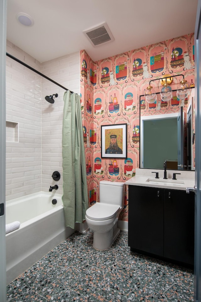 full bathroom featuring shower / bath combo with shower curtain, vanity, and toilet