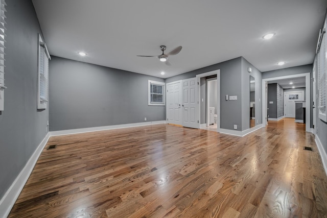 interior space featuring ceiling fan and hardwood / wood-style flooring