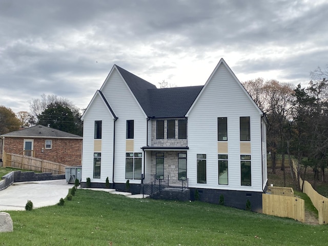 modern farmhouse with a front lawn