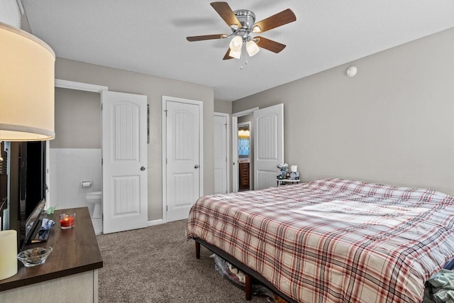 bedroom with carpet flooring, connected bathroom, and ceiling fan