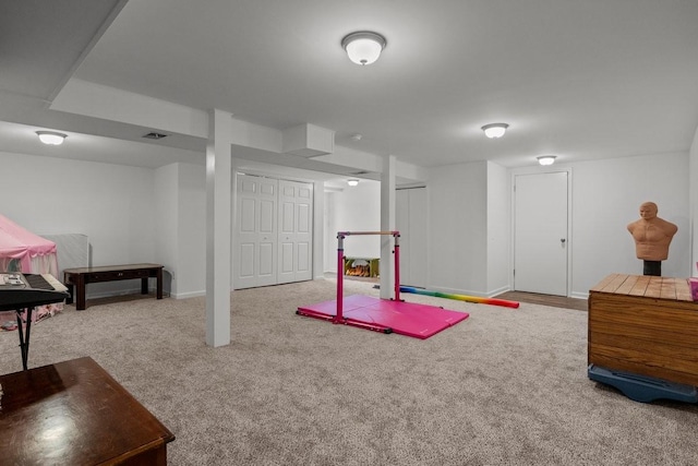 rec room featuring light carpet