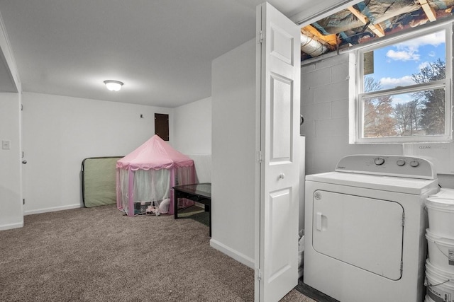 clothes washing area featuring carpet and separate washer and dryer