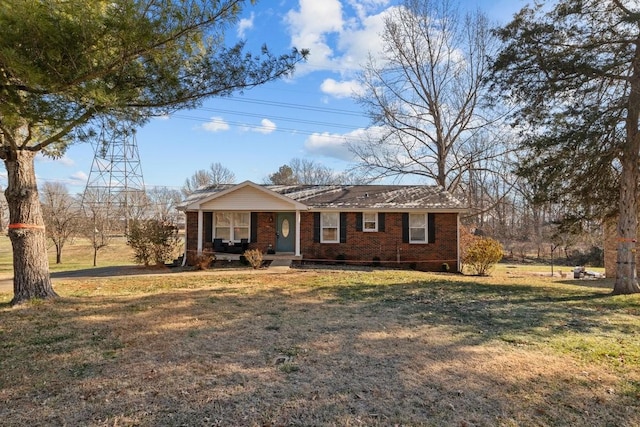 single story home featuring a front yard