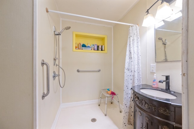 bathroom featuring vanity and curtained shower