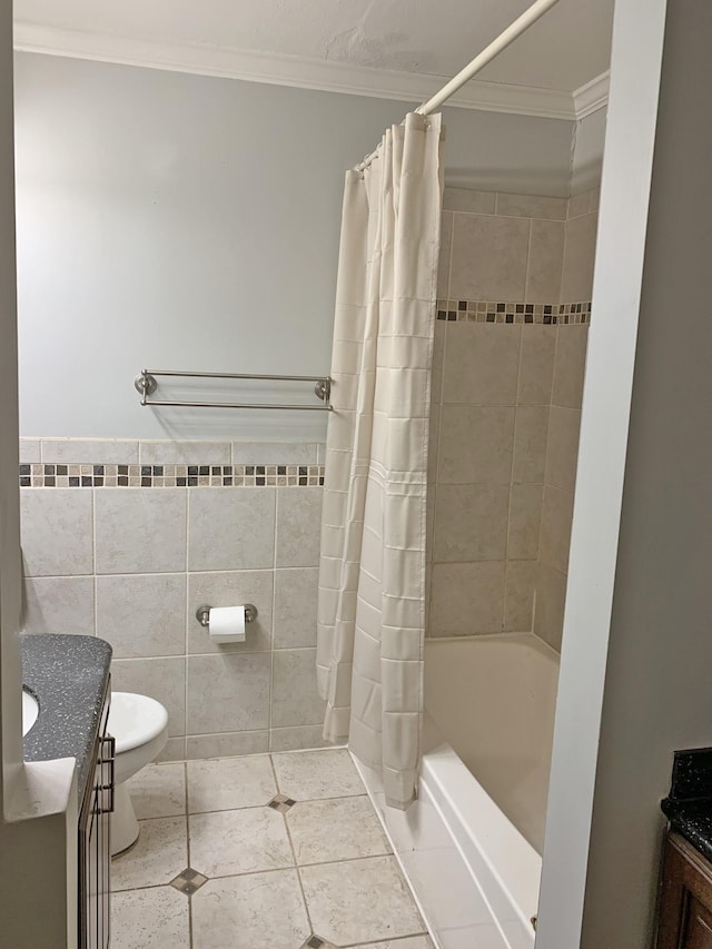 full bathroom featuring tile walls, vanity, ornamental molding, shower / tub combo, and tile patterned floors