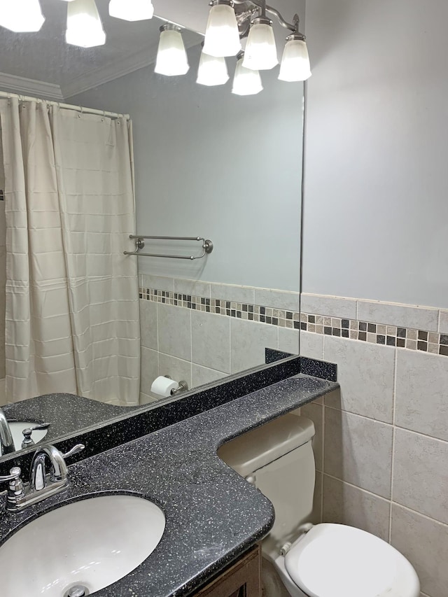 bathroom with tile walls, vanity, ornamental molding, a shower with curtain, and toilet