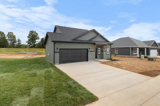 view of front facade featuring a garage and a front lawn