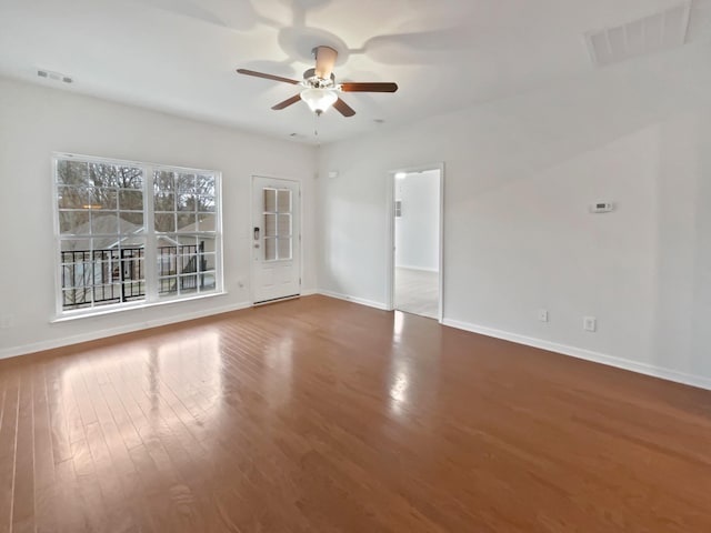 spare room with wood-type flooring and ceiling fan