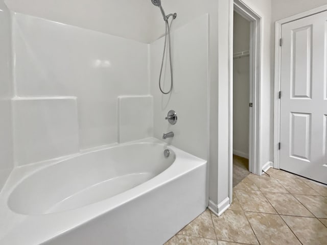 bathroom featuring tile patterned flooring and shower / bathing tub combination