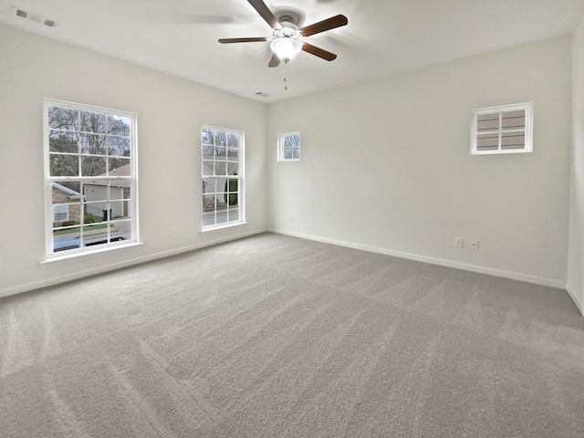 carpeted empty room with ceiling fan