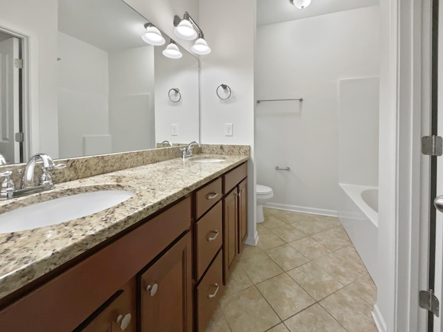 bathroom featuring tile patterned floors, vanity, and toilet