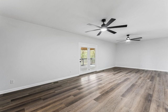 unfurnished room with dark hardwood / wood-style flooring and ceiling fan