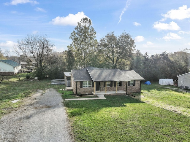 ranch-style house with a front lawn