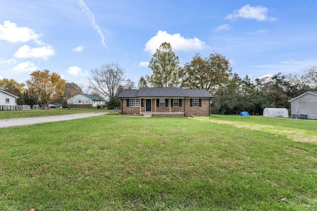 ranch-style home featuring a front lawn